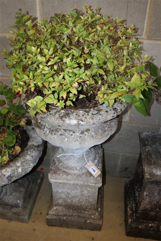 A reconstituted stone urn on plinth, height approx. 79cm, width approx. 42cm